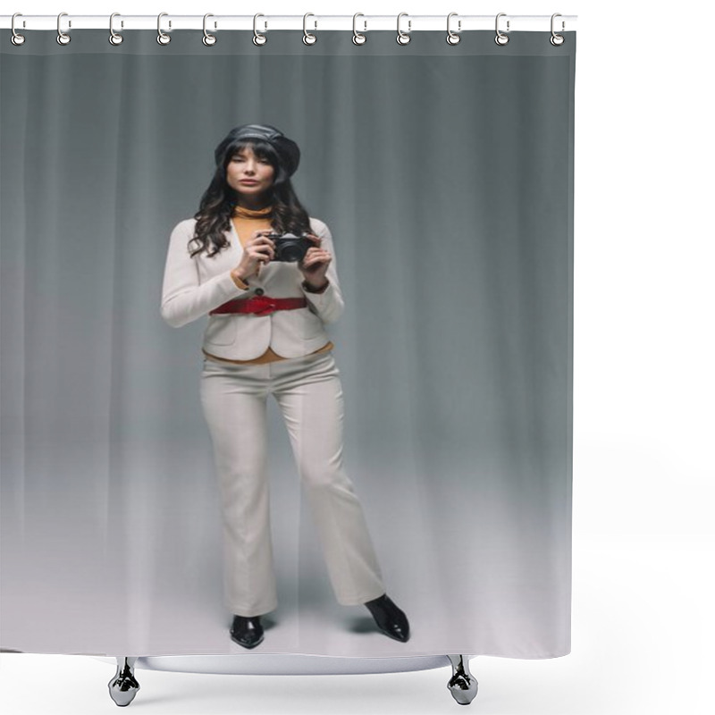 Personality  Attractive Brunette Woman In White Suit Standing With Film Camera On Gray Shower Curtains