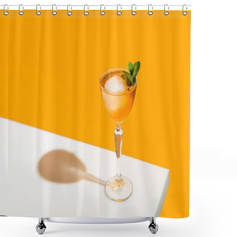 Personality  Elegant Stemware Glass Of Fresh Orange Cocktail With Big Ice Ball On White Table Surface, Bright Yellow Background. Spring Summer Art Drink Food Concept. Shower Curtains