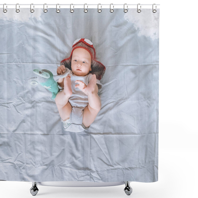 Personality  Top View Of Infant Child In Knitted Pilot Hat Playing With Toy Plane In Bed Shower Curtains