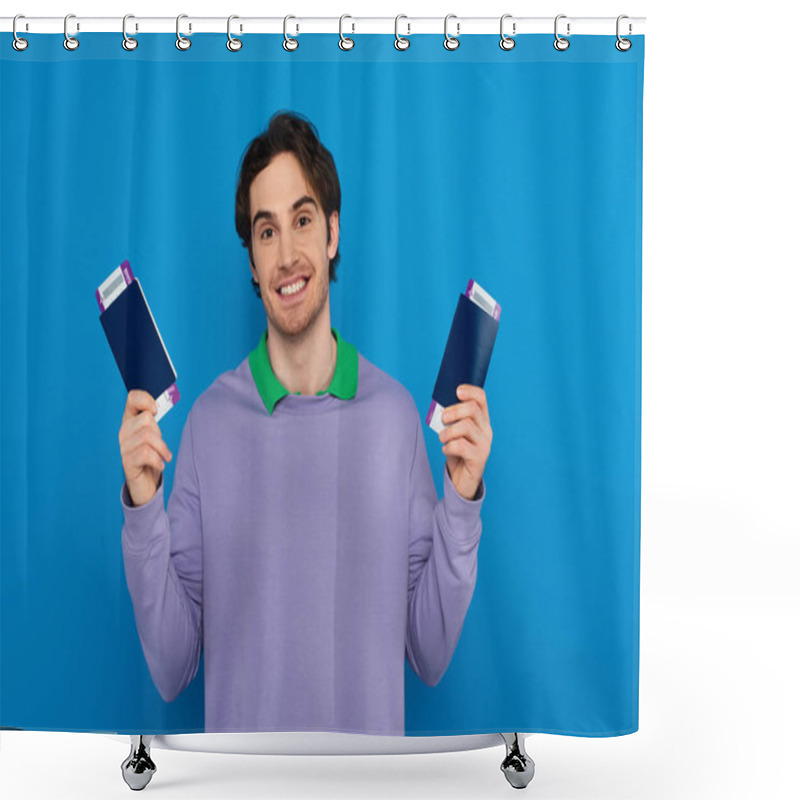 Personality  Happy Young Man Holding Passports With Air Tickets In Hands Isolated On Blue Shower Curtains