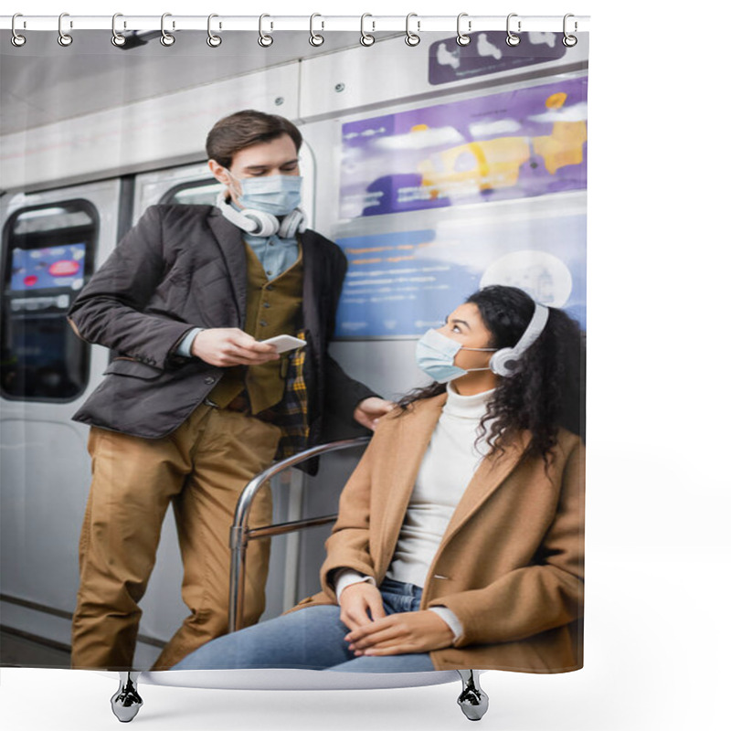 Personality  Man In Headphones Holding Smartphone And Looking At African American Woman In Medical Mask In Subway Shower Curtains