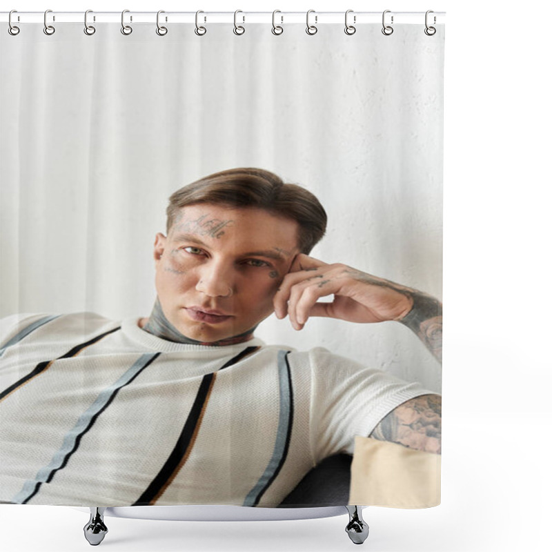 Personality  A Young Man With Striking Tattoos Relaxes Comfortably On A Sofa In A Modern Room. Shower Curtains