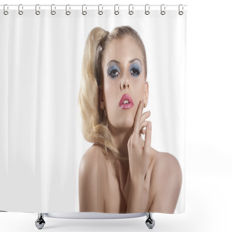 Personality  Blond girl with creative make up posing and looking towards the shower curtains