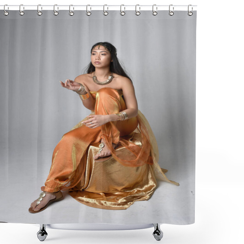 Personality  Full Length Portrait Of Pretty Young Asian Woman Wearing Golden Arabian Robes Like A Genie, Seated Pose, Isolated On Studio Background. Shower Curtains