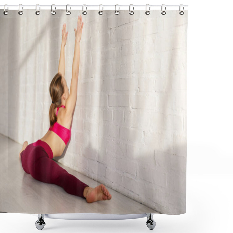 Personality  Flexible Young Woman Doing Twine Stretching Near Brick Wall In Yoga Studio  Shower Curtains