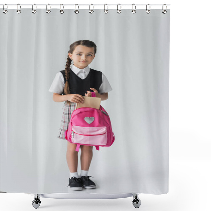 Personality  Full Length Of Cute Schoolgirl In Uniform Holding Pink Backpack And Book On Grey  Shower Curtains