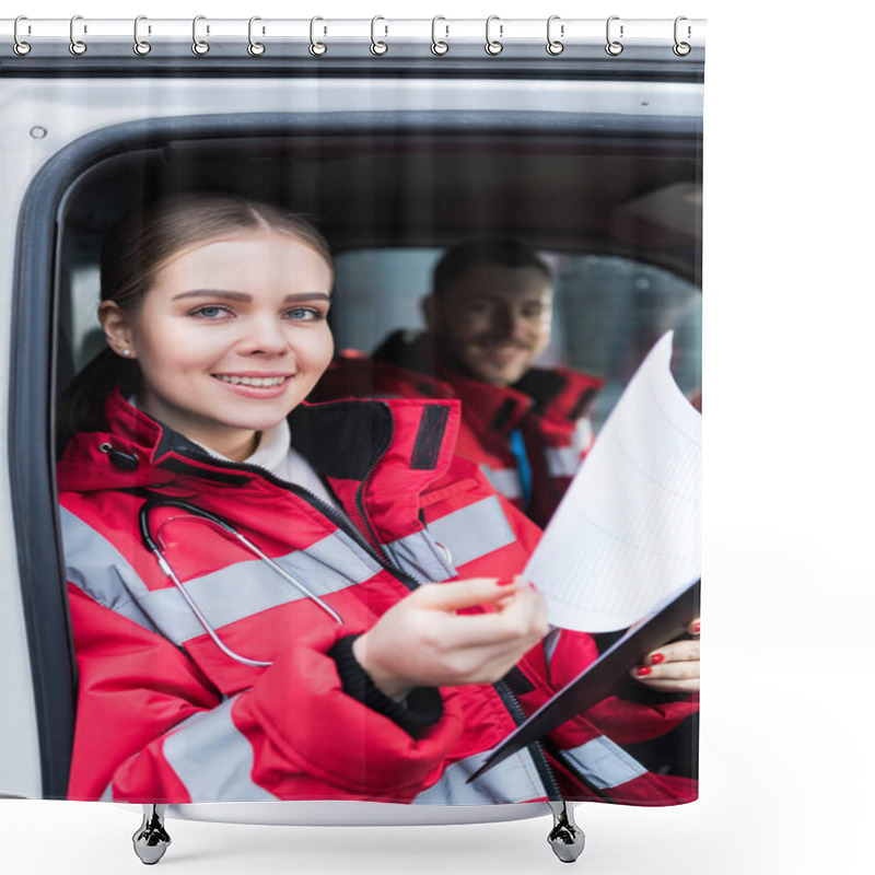 Personality  Smiling Young Female Paramedic Holding Clipboard And Looking At Camera Shower Curtains