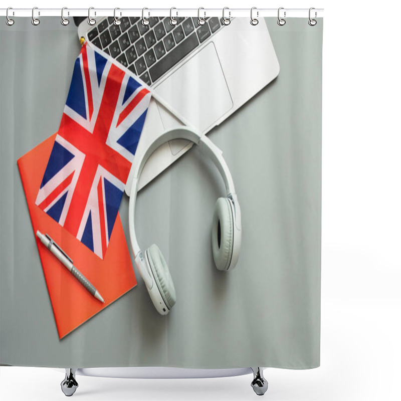 Personality  Concept Of Online Learning English, Foreign Languages, Distance Education, Knowledge, Modern Technologies For Study. Laptop, English Flag, Headphones, Notebook. Grey Background. Copy Space. Nobody. Shower Curtains