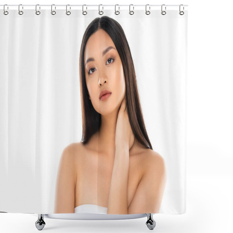 Personality  Brunette Asian Woman Looking At Camera While Touching Neck Isolated On White Shower Curtains