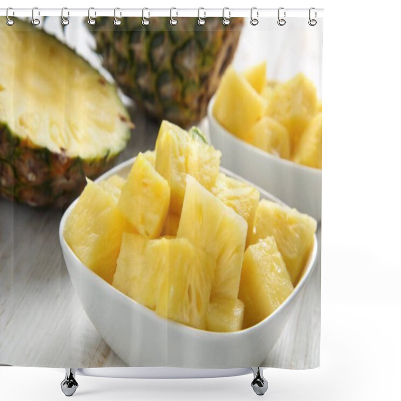 Personality  A Photo Of A Still Life Featuring A Close-up Of A Bowl Filled With Fresh, Yellow Pineapple Slices. The Bowl Is White And Placed On A Surface With A Patterned Cloth Underneath. A Partially Sliced Pineapple Lies Next To The Bowl. The Background Consist Shower Curtains