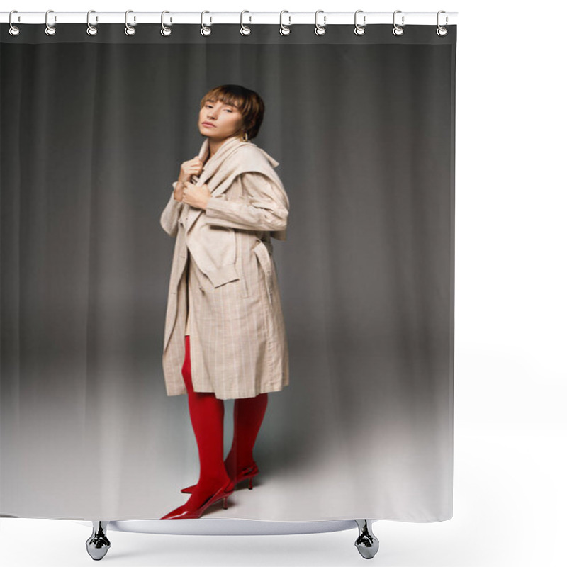 Personality  A Young Woman With Short Hair Confidently Struts In A Stylish Trench Coat And Vibrant Red Boots In A Studio Setting. Shower Curtains