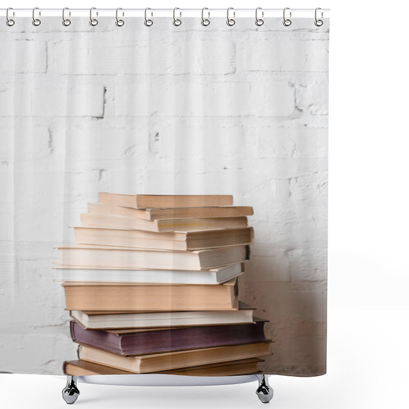 Personality  Pile Of Books Near White Brick Wall With Copy Space Shower Curtains