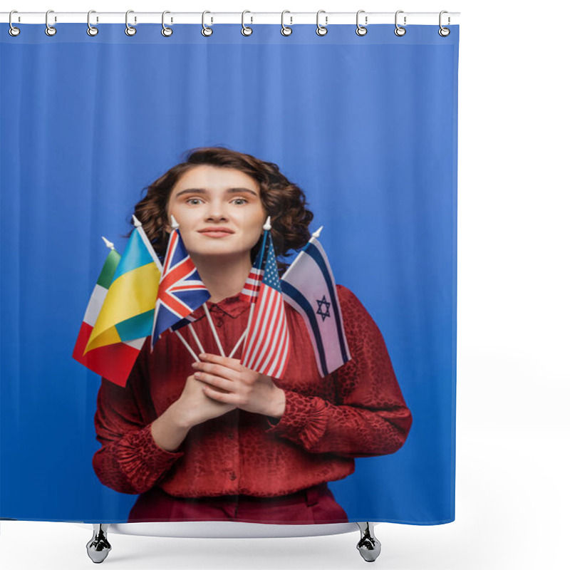 Personality  Amazed Woman Holding Flags Of Various Countries And Looking At Camera Isolated On Blue Shower Curtains