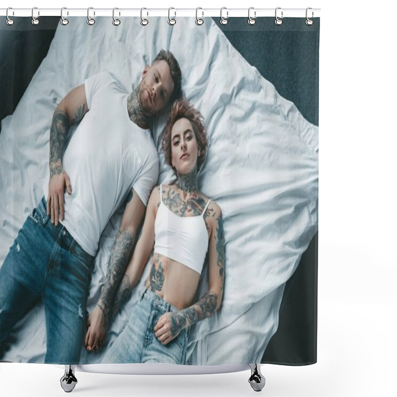 Personality  Top View Of Young Tattooed Couple Holding Hands And Lying On Bed Shower Curtains