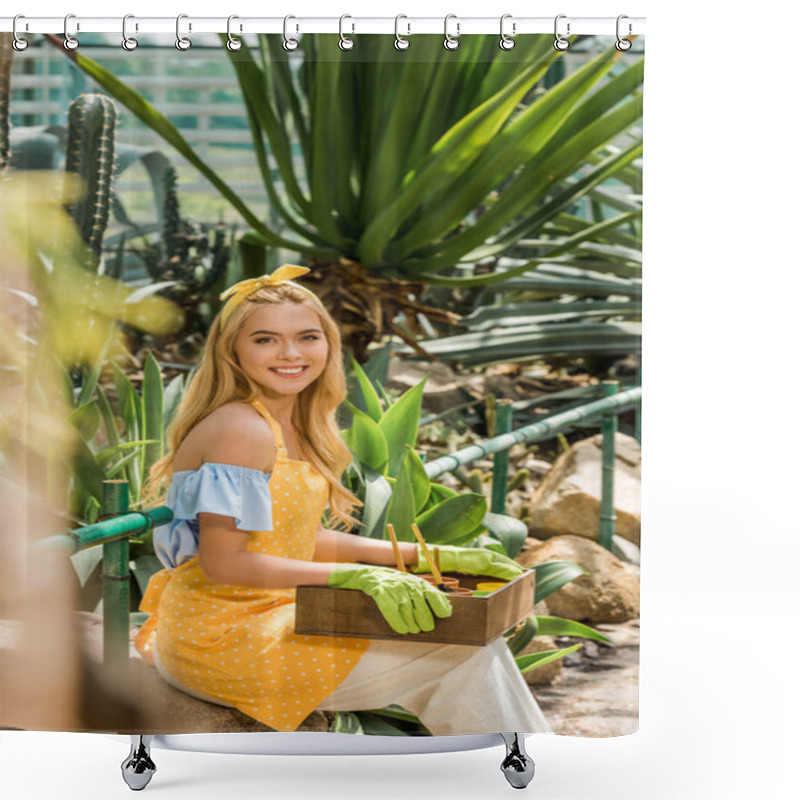 Personality  Selective Focus Of Beautiful Blonde Girl Holding Box With Gardening Tools And Smiling At Camera In Greenhouse Shower Curtains