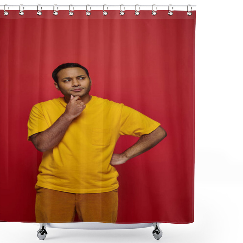 Personality  Pensive Indian Man In Bright Casual Attire Standing With Hand Near Chin On Red Background In Studio Shower Curtains