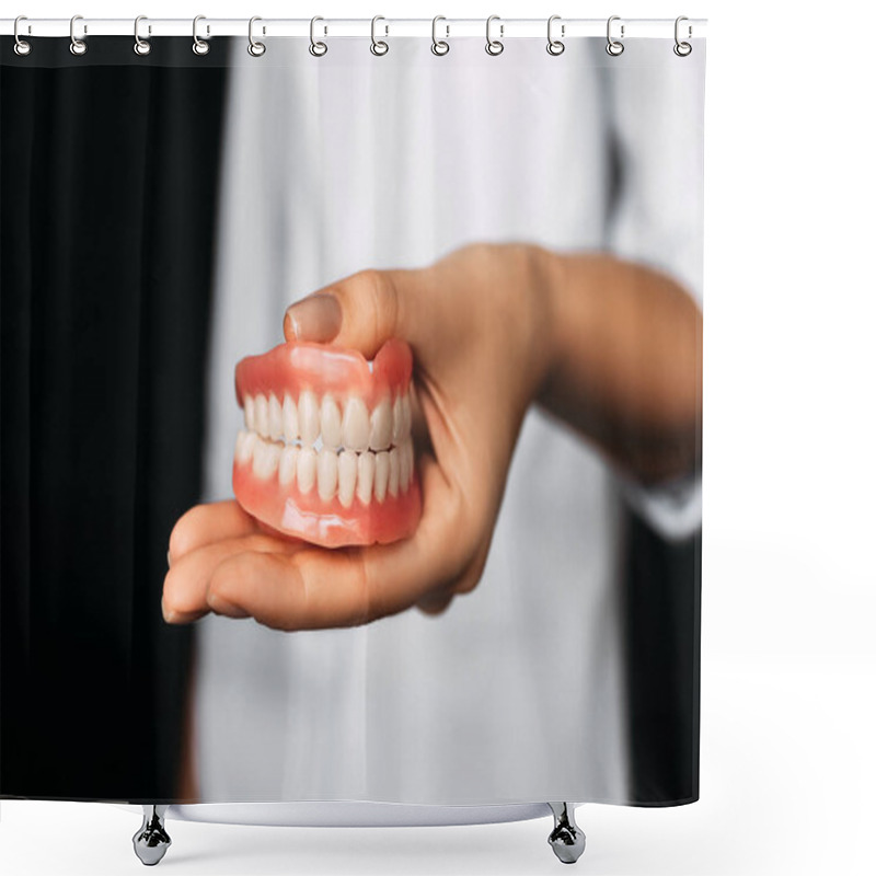 Personality  The Dentist Is Holding Dentures In His Hands. Dental Prosthesis In The Hands Of The Doctor Close-up. Front View Of Complete Denture. Dentistry Conceptual Photo. Prosthetic Dentistry. False Teeth Shower Curtains