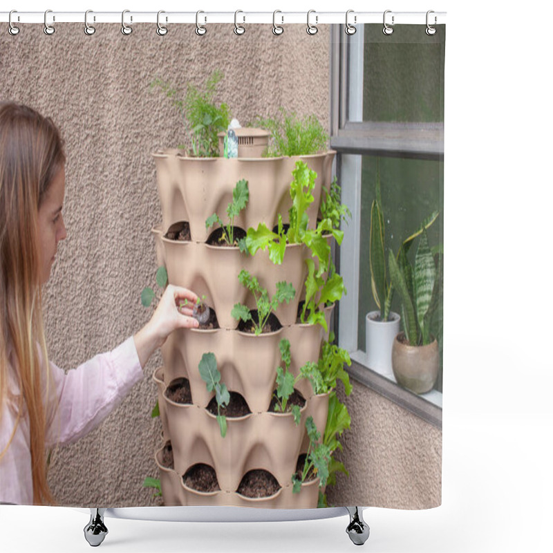 Personality  A Young Blonde Woman Is Planting A Vertical Tower Garden With Herbs And Vegetables On Her Apartment Patio, In The Early Spring. She Is Holding A Small Starter, Ready To Plant It.  Shower Curtains