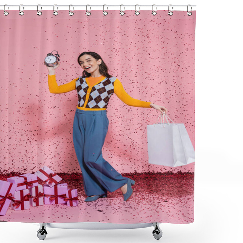 Personality  Joyful And Fashionable Woman Posing With Alarm Clock And Shopping Bags Near Confetti And Gift Boxes On Pink Background Shower Curtains