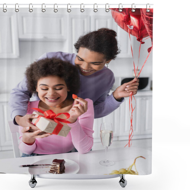 Personality  Smiling African American Man Holding Balloons And Gift Near Girlfriend With Strawberry And Champagne At Home  Shower Curtains