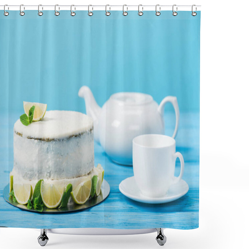 Personality  Cake Decorated With Slices Of Lime Near White Cup And Tea Pot Isolated On Blue Shower Curtains