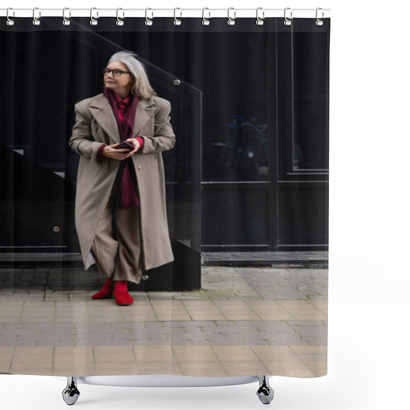 Personality  A Chic Elderly Woman With Gray Hair Wears A Long Overcoat And Striking Red Shoes While Standing Against A Sleek Black Backdrop In A Vibrant Urban Setting.. Shower Curtains