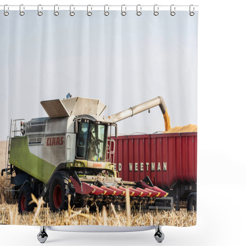 Personality  LVIV, UKRAINE - OCTOBER 23, 2019:  Farmer In Tractor With Claas Lettering Harvesting Wheat Against Blue Sky  Shower Curtains