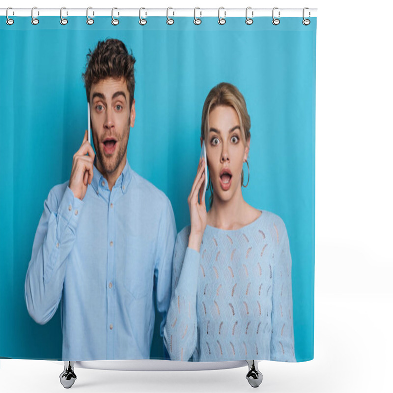 Personality  Surprised Man And Woman Looking At Camera While Talking On Smartphones On Blue Background Shower Curtains