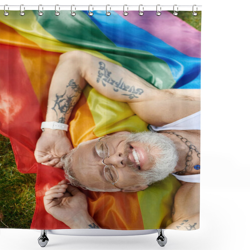 Personality  A Mature Gay Man With Tattoos And A Grey Beard Smiles While Lying On A Rainbow Pride Flag. Shower Curtains