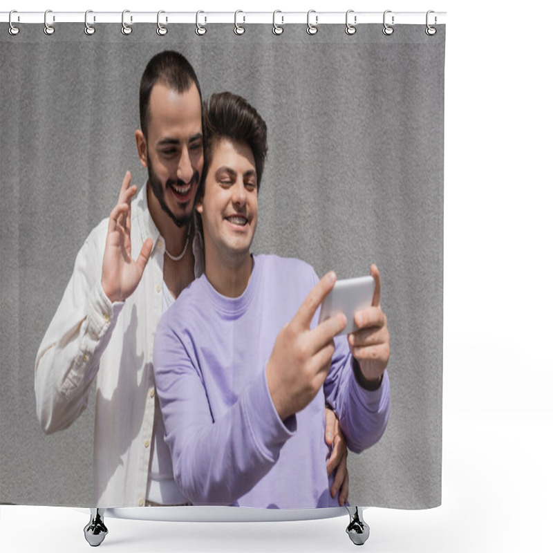 Personality  Smiling Gay Couple In Casual Clothes Having Video Call On Blurred Smartphone While Standing Together Near Building On Urban Street At Daytime   Shower Curtains