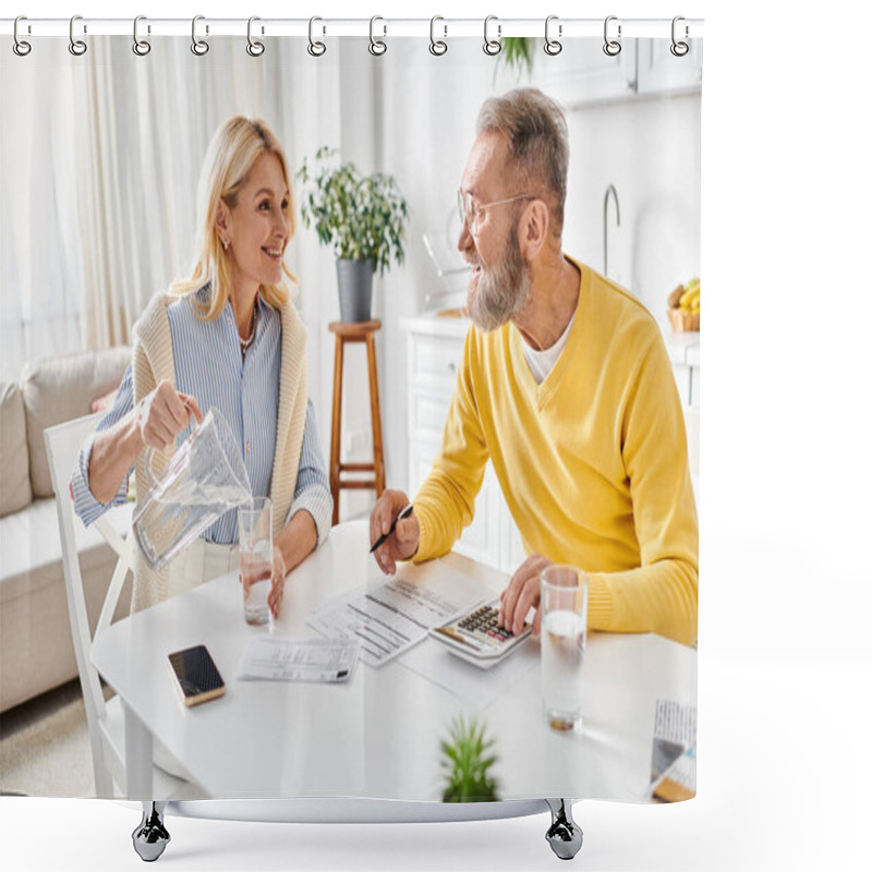 Personality  A Mature Man And Woman In Cozy Homewear Sitting At A Table, Focused On Using A Calculator For Financial Calculations. Shower Curtains