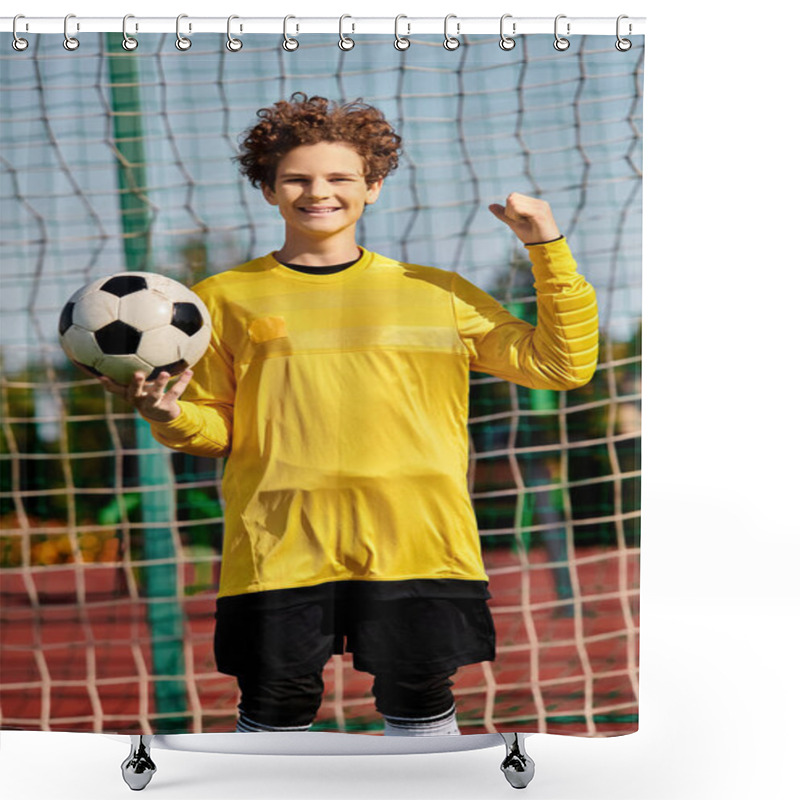 Personality  A Young Boy Stands In Front Of A Soccer Net, Holding A Soccer Ball In His Hands, With A Look Of Determination On His Face. Shower Curtains