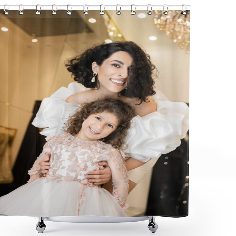 Personality  Charming Middle Eastern Bride With Brunette Hair Standing In White Wedding Gown With Puff Sleeves And Ruffles Behind Cute Daughter And Smiling Together In Bridal Store, Looking At Camera  Shower Curtains