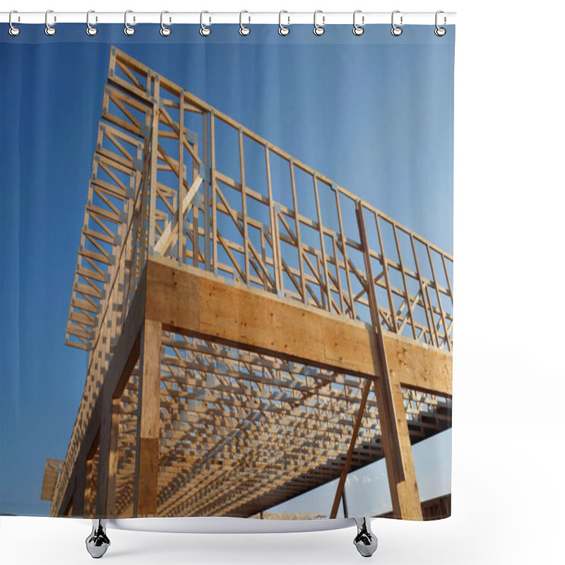 Personality  Wooden Roof And Wall Frame Of An Unfinished House Under Construction, Showcasing Beams, Planks, And Structural Design Against A Clear Blue Sky. Shower Curtains