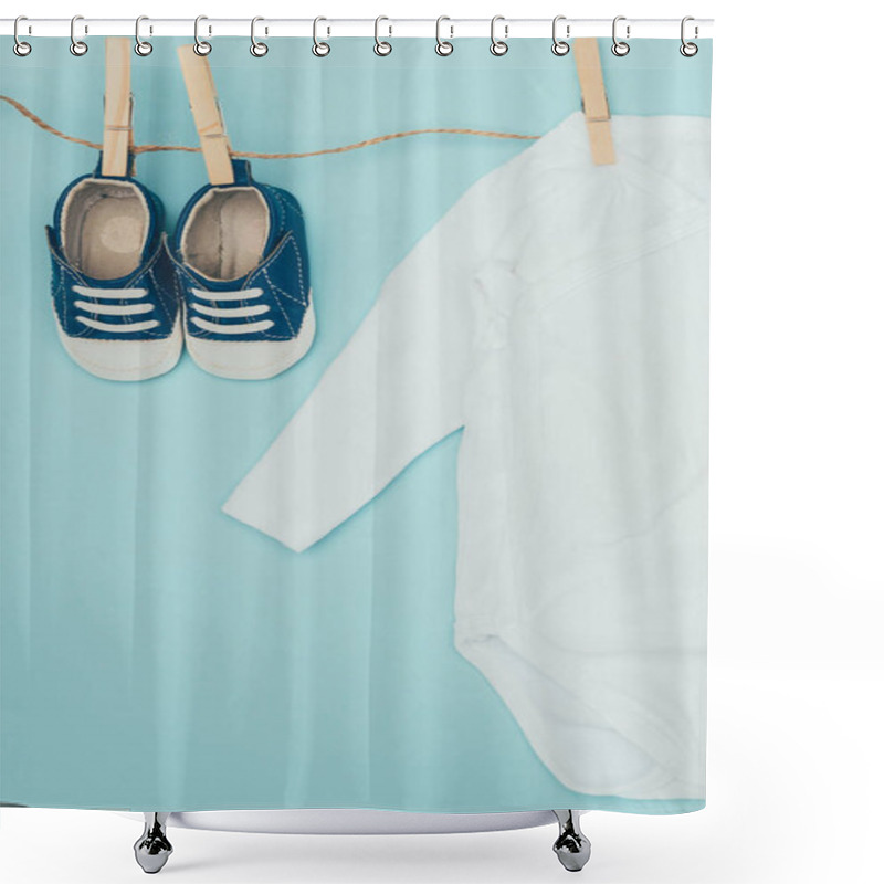 Personality  Top View Of Baby Bodysuit And Shoes Drying On Rope Isolated On Blue Shower Curtains