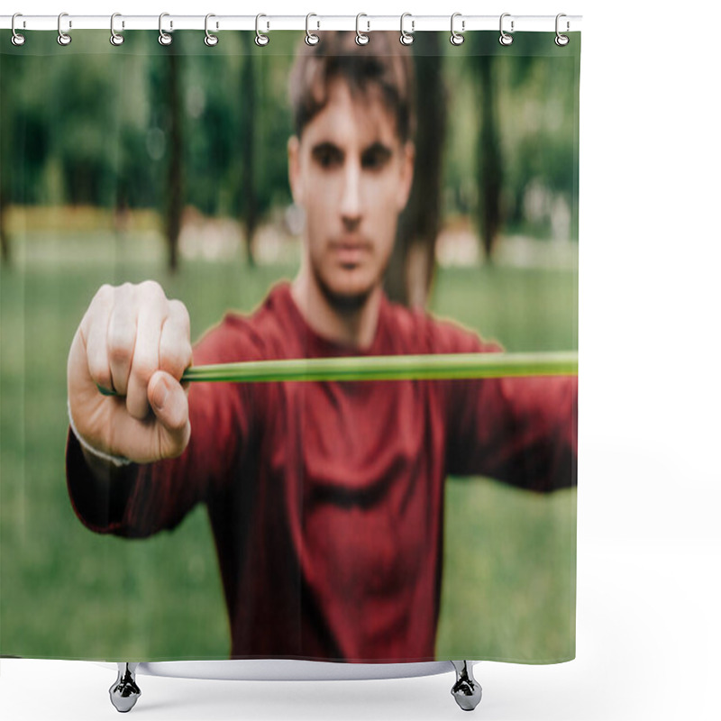 Personality  Selective Focus Of Sportsman Using Elastics Band While Training In Park  Shower Curtains