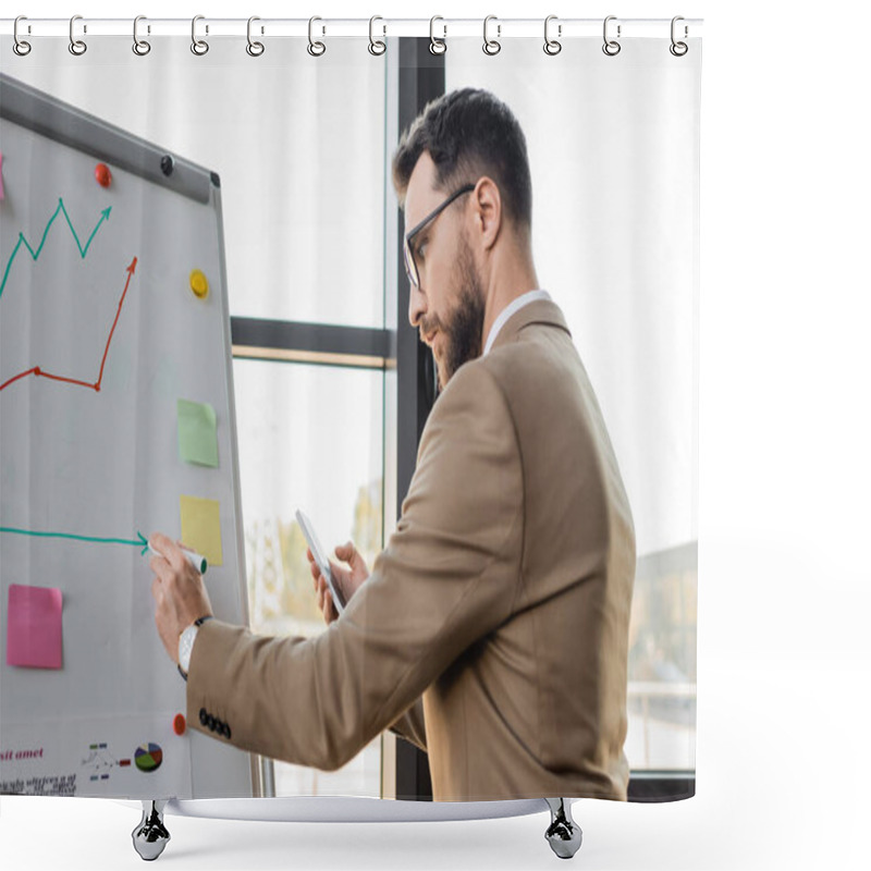 Personality  Side View Of Accomplished Businessman In Beige Suit And Eyeglasses Holding Mobile Phone And Drawing On Flip Chart While Making Productivity Analysis In Office Shower Curtains