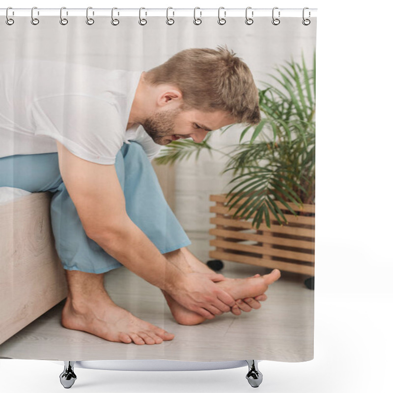 Personality  Young Man Touching Foot While Sitting On Bed And Suffering From Pain Shower Curtains