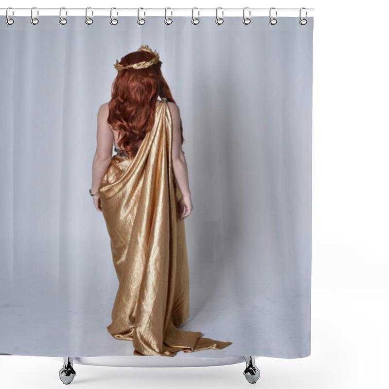 Personality  Full Length Portrait Of Girl With Red Hair Wearing Long Grecian Toga And Golden Wreath. Standing Pose With Back To The Camera,  Isolated Against A Grey Studio Background. Shower Curtains