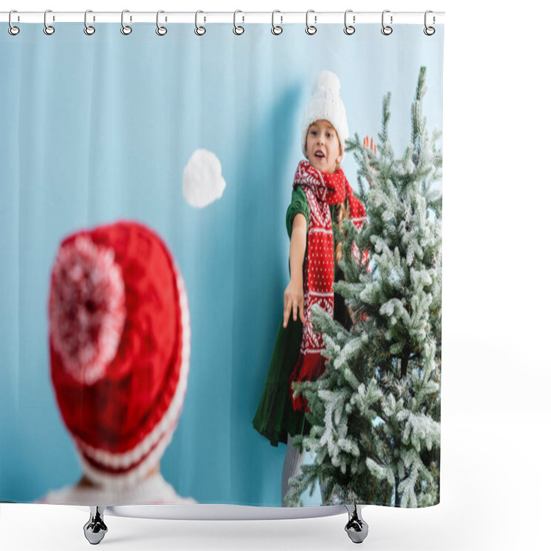 Personality  Selective Focus Of Girl In Hat And Scarf Throwing Snowball Near Brother On Blue  Shower Curtains