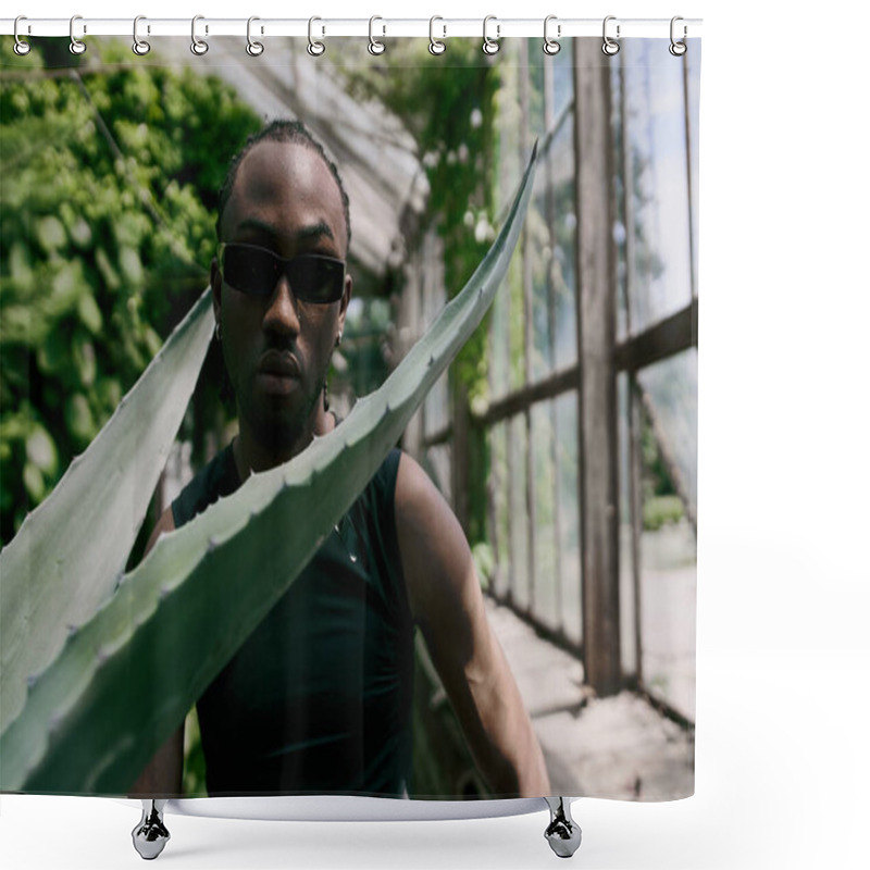 Personality  Handsome African American Man In Sunglasses Holding A Large Leaf In A Vibrant Green Garden. Shower Curtains