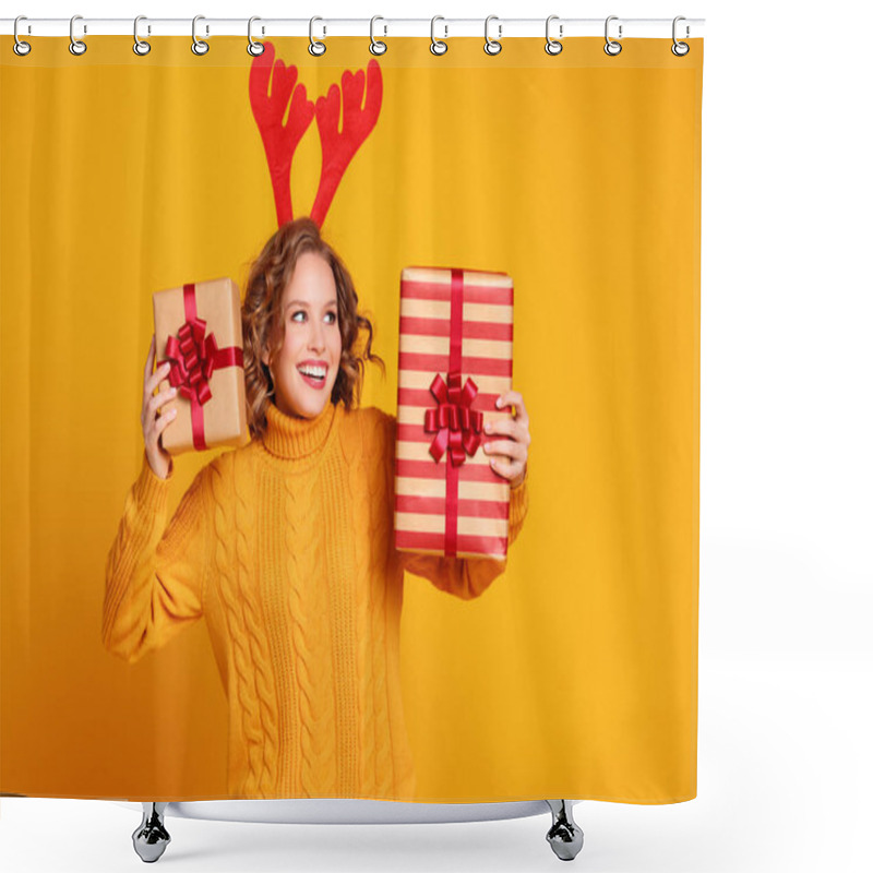 Personality  Happy Young Woman In Knitted Sweater With Red Deer Antlers  Showing Wrapped Gifts  And Looking Away With Smile On Christmas Day Against Yellow Backgroun Shower Curtains