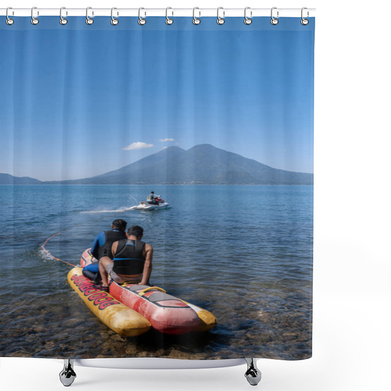 Personality  Young Hispanic Men Enjoy Tubing On An Airhead Hot Dog In Atitlan Lake, Guatemala, Showcasing The Excitement Of Water Recreation Shower Curtains