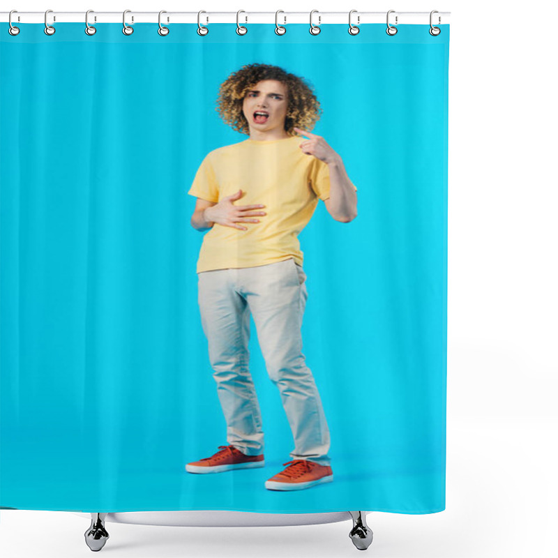 Personality  Hungry Curly Teenager Pointing With Finger At Mouth And Touching Stomach Isolated On Blue Shower Curtains