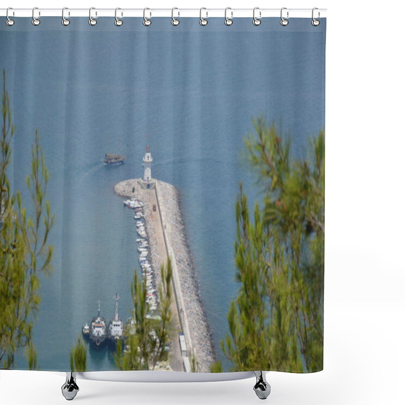 Personality  The Image Captures Alanya Lighthouse On A Rocky Pier Extending Into The Sea. Boats Are Docked Along The Pier, And A Small Ship Sails Nearby. The View Is Framed By Pine Trees, With Calm Blue Water In The Background Shower Curtains