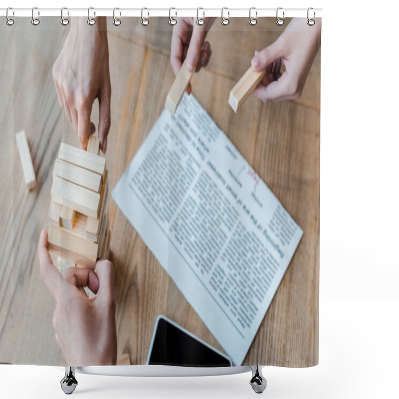 Personality  KYIV, UKRAINE - NOVEMBER 22, 2019: Cropped View Of Women Playing Blocks Wood Tower Game Near Smartphone With Blank Screen  Shower Curtains