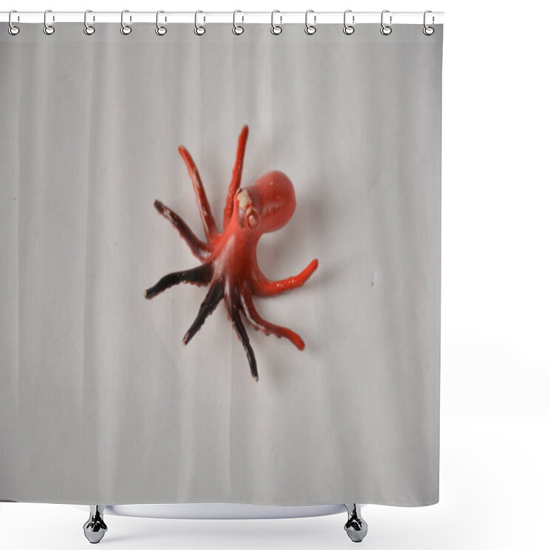 Personality  Small, Realistic Toy Octopus With Red And Black Tentacles On A White Background. Shower Curtains