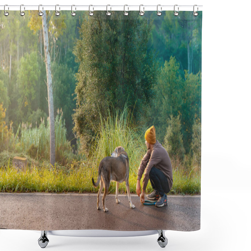 Personality  Young Handsome Man Walking His Dog In Nature With The Rays Of The Morning In Autumn. Friendship And Animal Love Concept. Sun, Warm Glow And Long Shadows. Shower Curtains