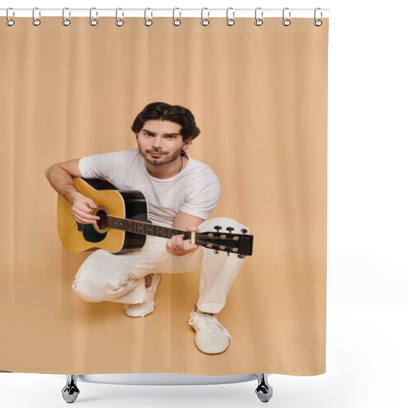 Personality  Handsome Young Man Crouching While Strumming A Guitar, Exuding Creativity And Joy In A Warm Setting. Shower Curtains