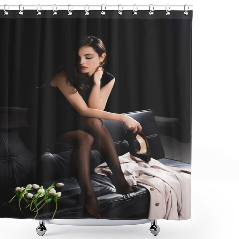 Personality  Attractive Woman In Black Dress Sitting On Couch With Tulips And Holding Shoes On Dark Background Shower Curtains